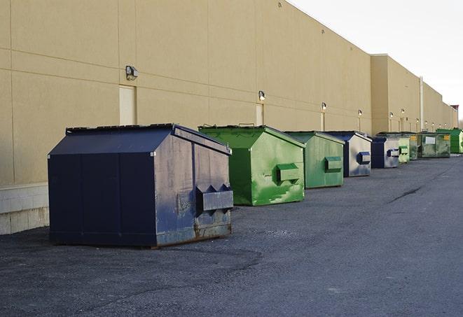 an empty dumpster ready for use at a construction site in Manhattan, IL